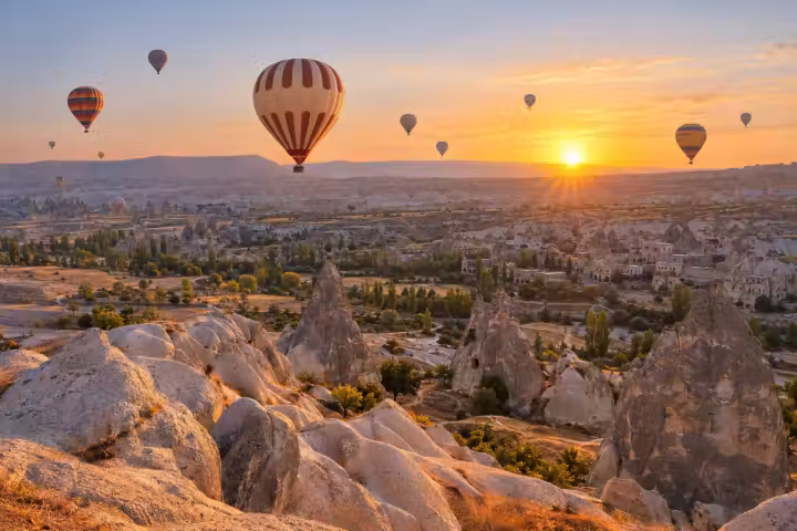 Hot air balloons above Cappadocia’s fairy chimneys at sunrise