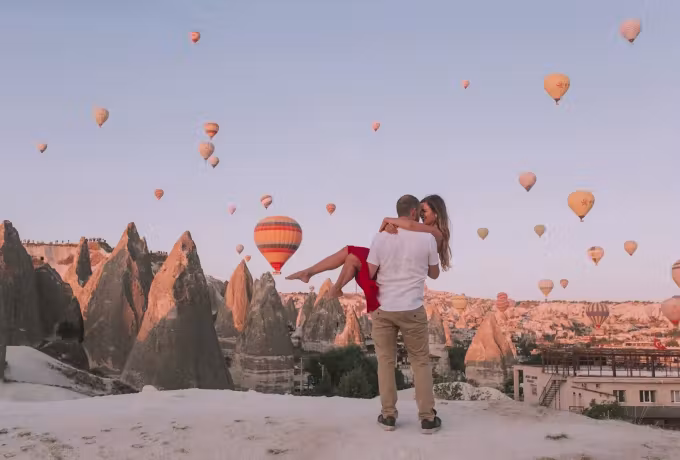 Lifted clear of the ground on a rimed spine with the whole fleet out in pale air, Cappadocia