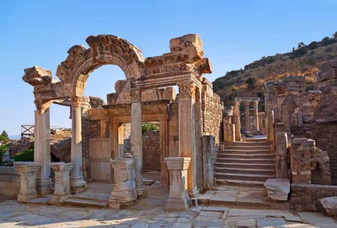 Richly cut opening to the Hadrian shrine on the old processional way, a stair rising past it, Ephesus