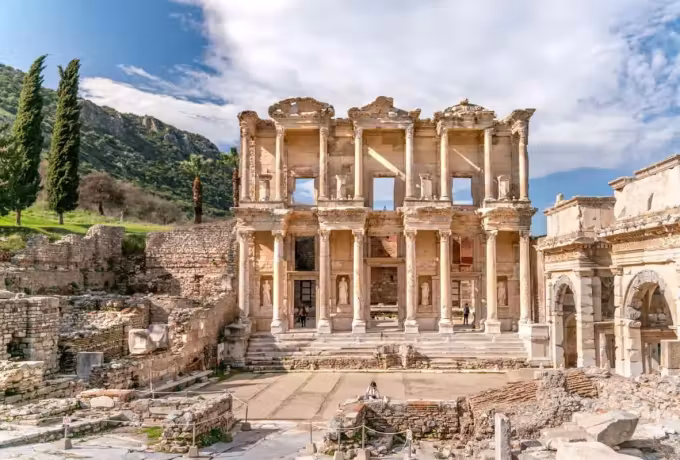 Springtime landscape frame with a solitary palm to one hand and fresh growth on the bank, Ephesus