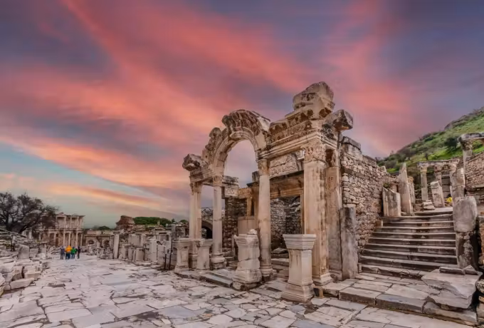 Evening colour drawn in bands above the richly cut Hadrian opening on the processional way, Ephesus