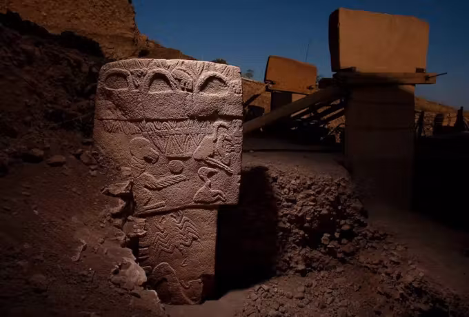 Birds, snakes and banded patterns worked across the whole front of one Gobeklitepe upright