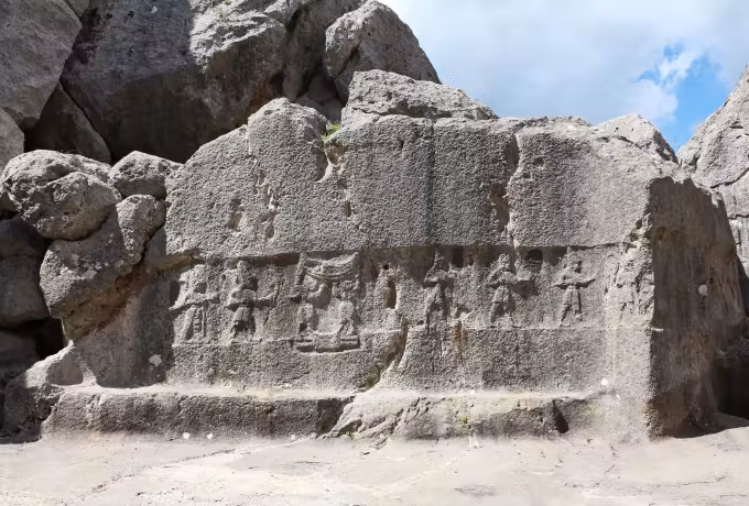 Broad relief of deities cut across one big boulder inside the Yazilikaya shrine