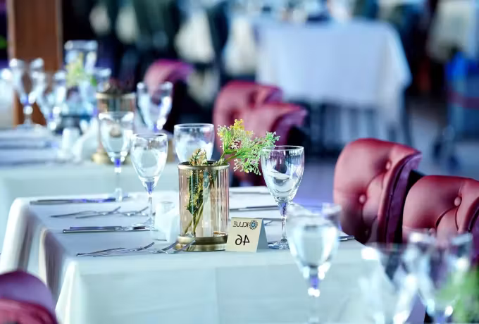 White linen and place settings down the length of the saloon before an Istanbul cruise sails