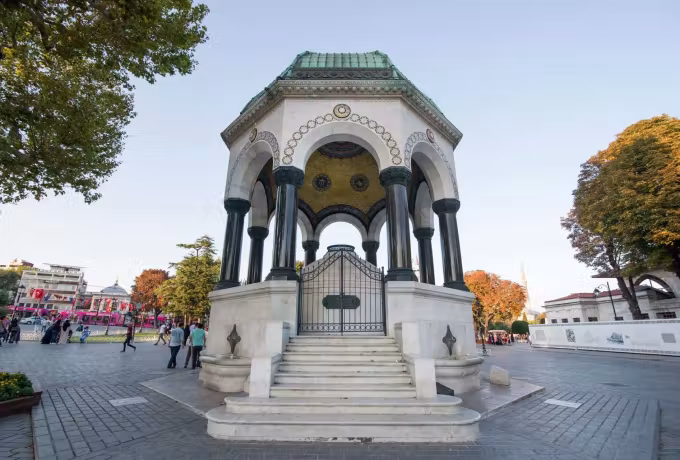 Dark marble shafts, gilt mosaic ceiling and carved base of the octagonal fountain, Istanbul