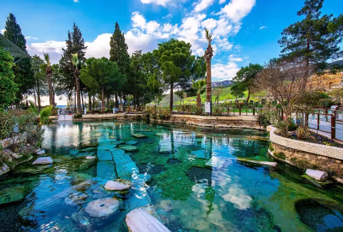 Cut sections of ancient shafts visible on the floor of the warm bathing basin, Pamukkale
