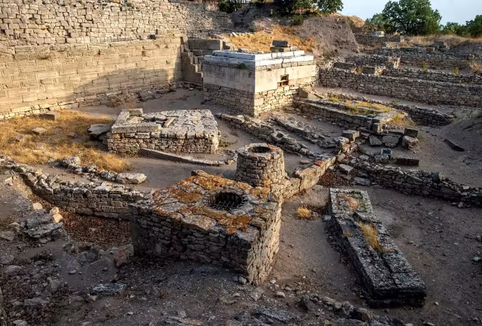 Remains at several levels with round stone tubs, close in on the Troy dig