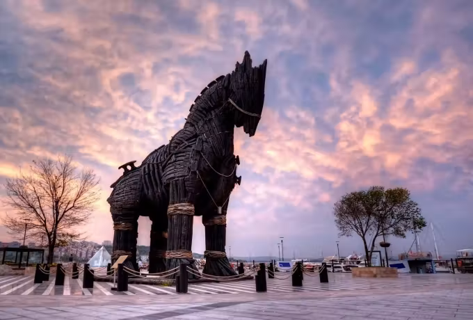 Waterfront silhouette at Canakkale, the famous timber figure against a pink and violet dusk