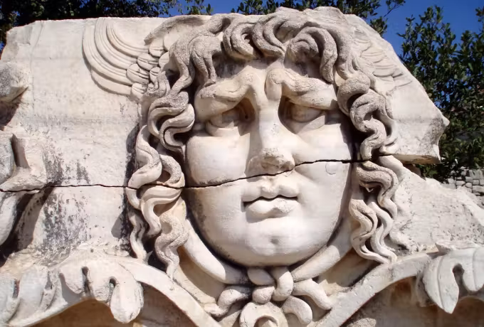 Colossal Gorgon face, snakes twisting from its brow, left on the ground at Didyma