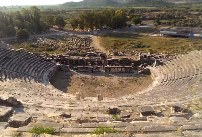 Where ships once lay at Miletus there is now level grass, the auditorium looking out over it
