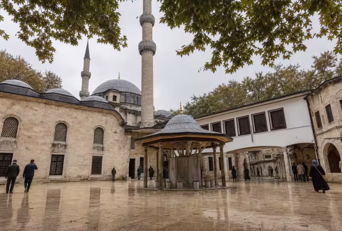 Covered washing fountain standing in a light stone court at the Eyup Sultan foundation