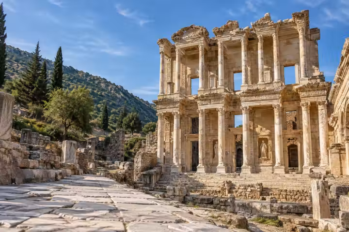 The Library of Celsus facade beside an ancient marble street at Ephesus